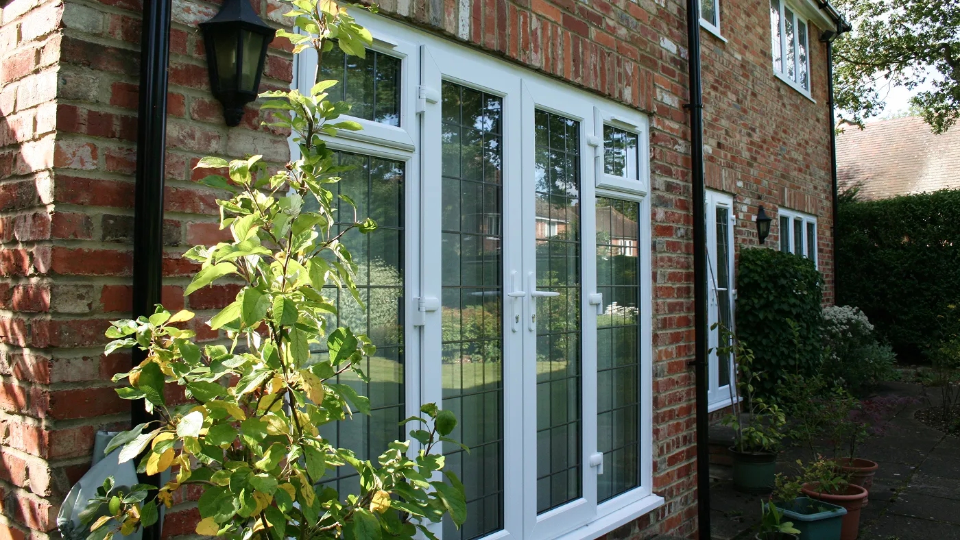 White uPVC French doors with side panels on brick property, Chalfont St Giles