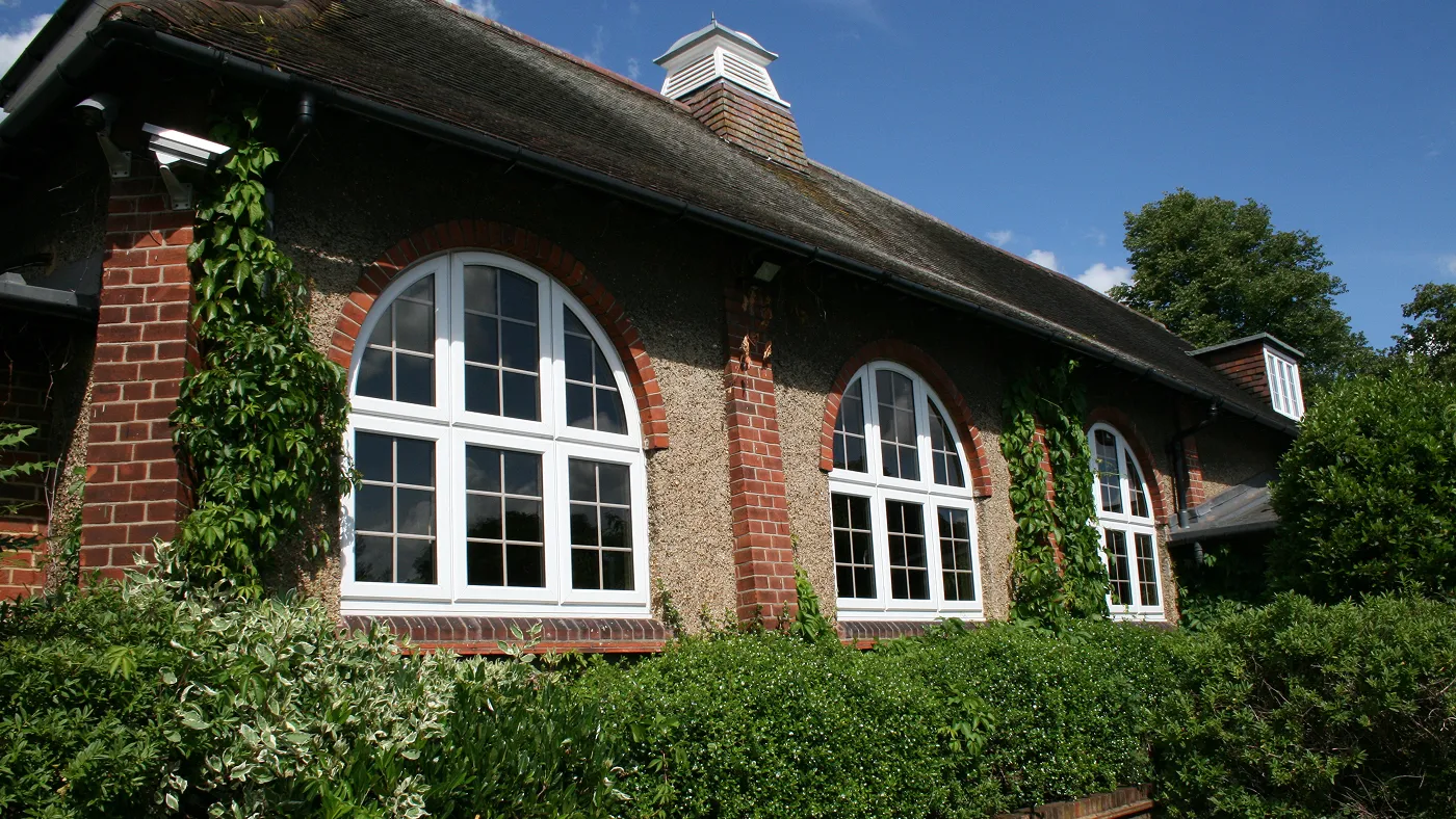 Arched casement windows installed in character cottage, Iver