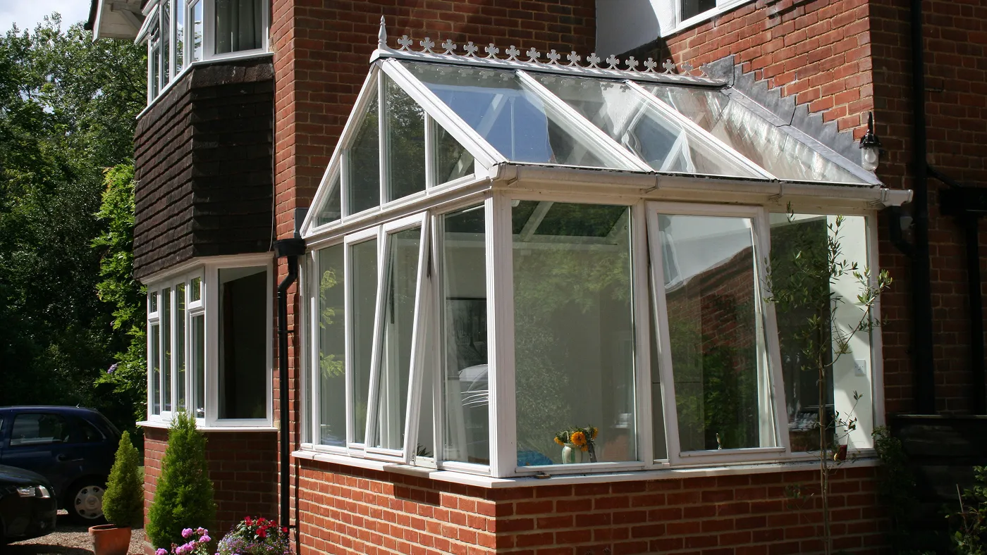 White Edwardian uPVC conservatory on red brick house, Windsor