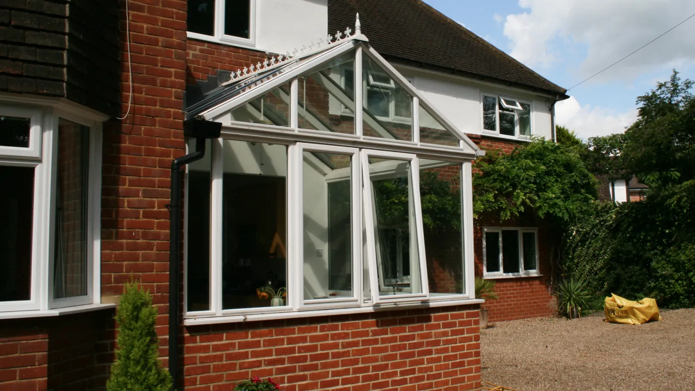 White Edwardian uPVC conservatory on red brick house, Windsor