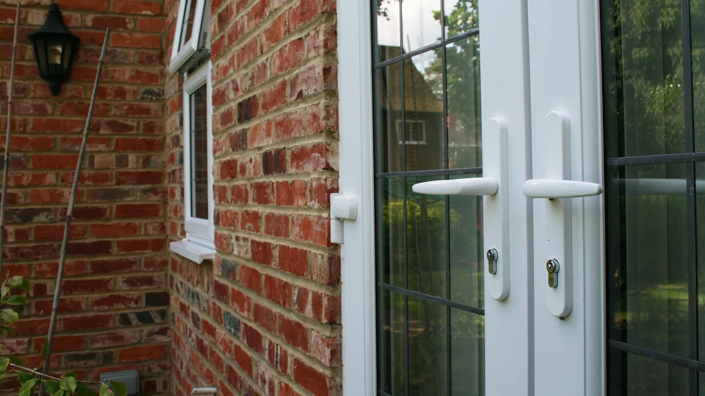 White uPVC French doors on brick rear elevation, Farnham Royal
