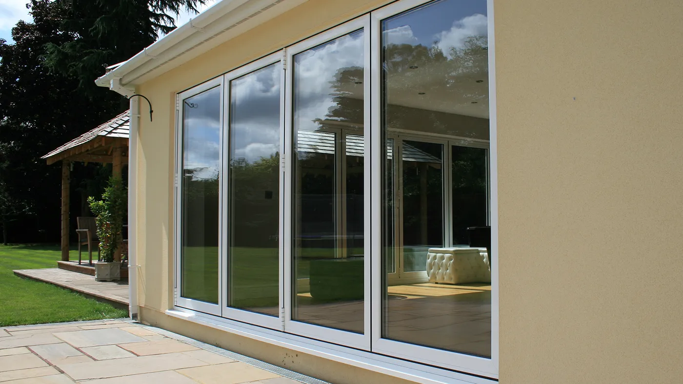 White bi-fold doors across rear of bungalow extension, Beaconsfield