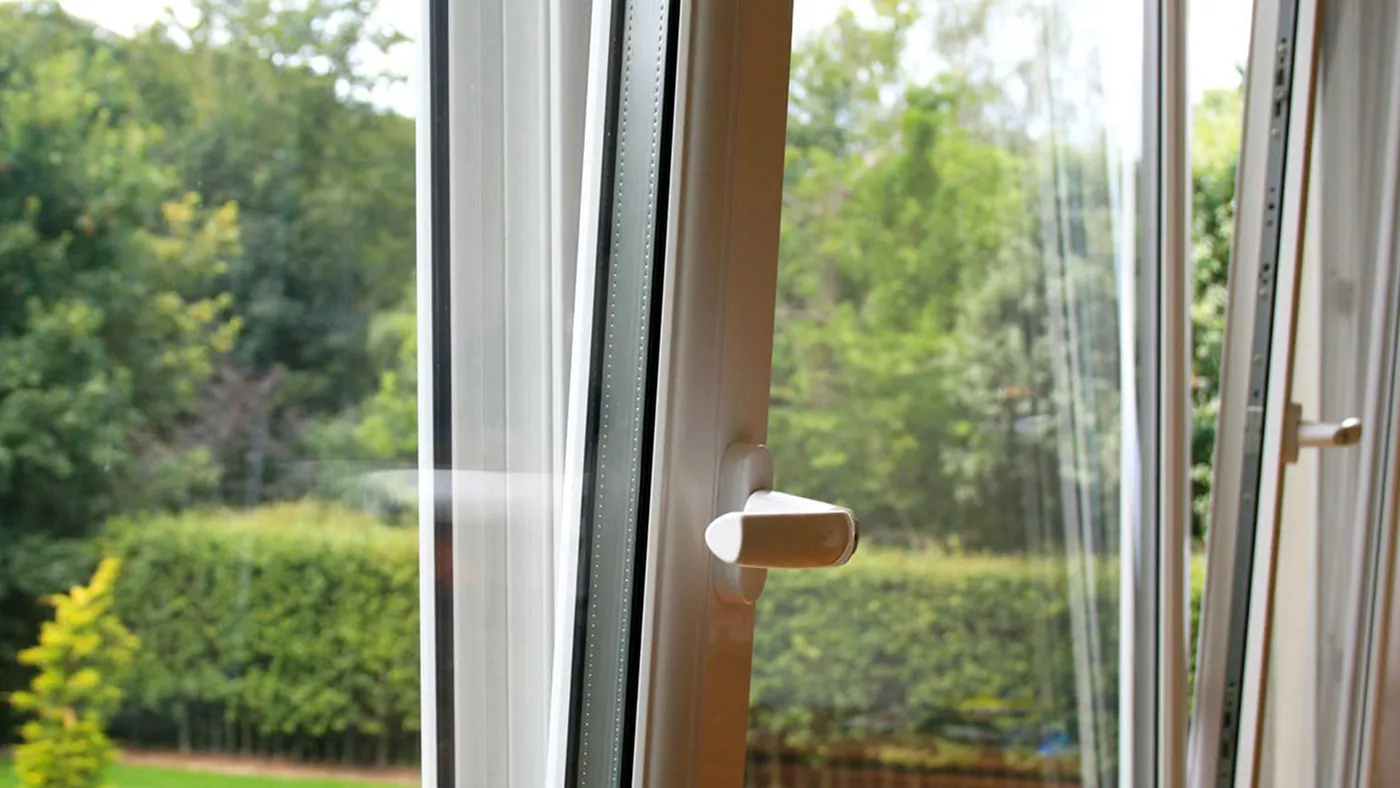 White tilt and turn window shown in tilt position, close-up detail
