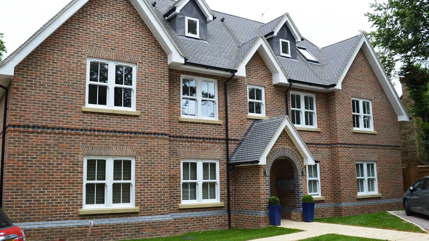 White sash windows on red brick detached house, Marlow