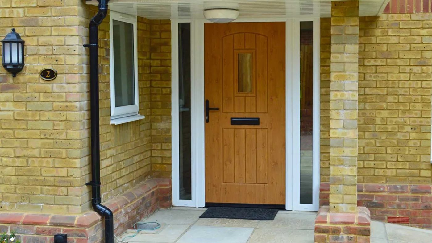 Mustard yellow composite door on brick terraced house, Iver