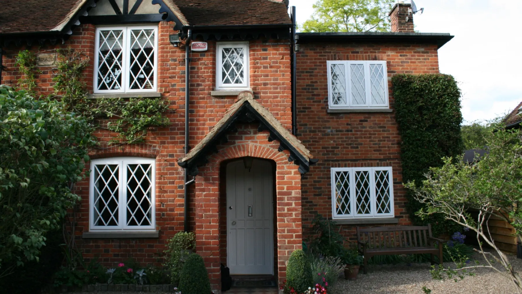 Diamond-pane leaded window in a white frame