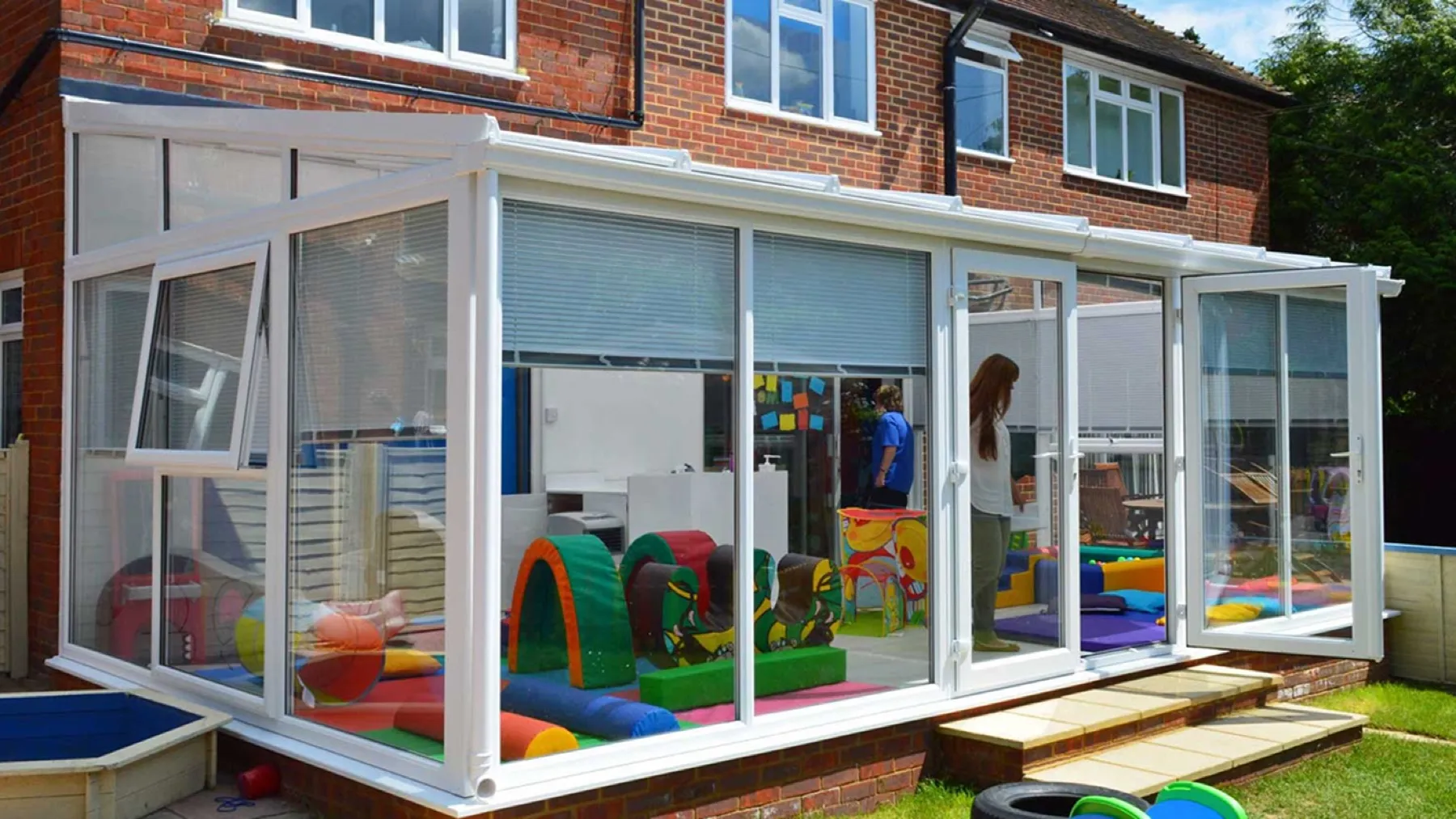 Close-up of glazed panels and an open vent window on a conservatory